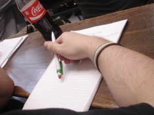 A Jobbik student attends class with pen and bracelet in the colours of the Hungarian flag